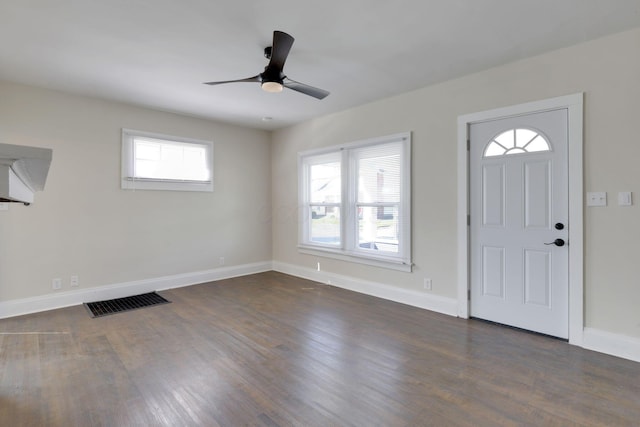 entryway featuring visible vents, dark wood-type flooring, a healthy amount of sunlight, and ceiling fan
