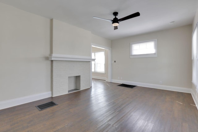 unfurnished living room with baseboards and visible vents