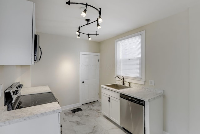 kitchen with visible vents, marble finish floor, white cabinetry, a sink, and appliances with stainless steel finishes