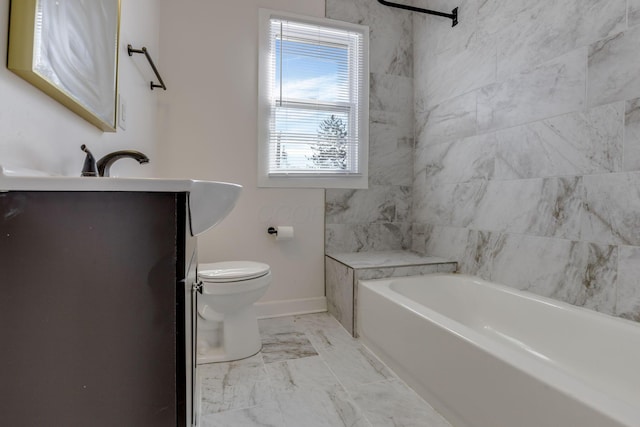 full bathroom with a tub, vanity, baseboards, toilet, and marble finish floor