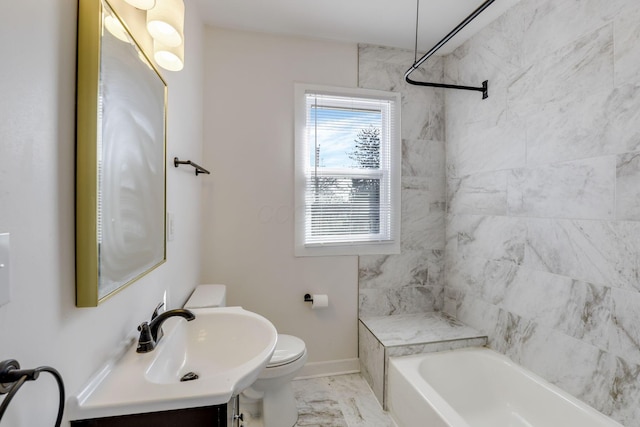 bathroom featuring vanity, baseboards, toilet, marble finish floor, and bathing tub / shower combination