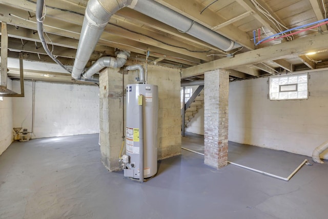 basement with stairs and water heater