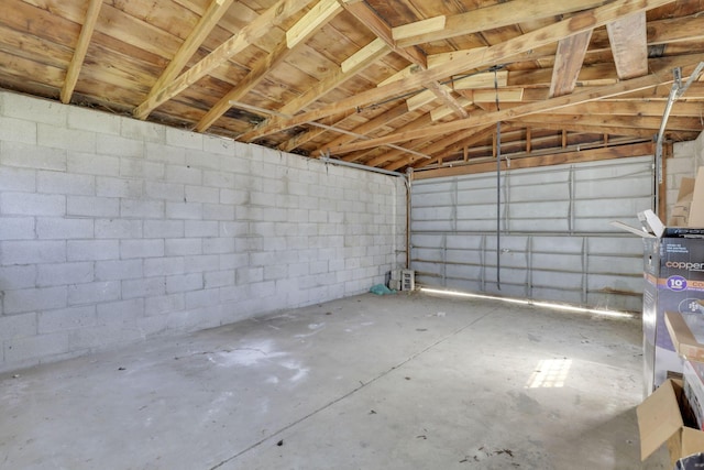 garage with concrete block wall