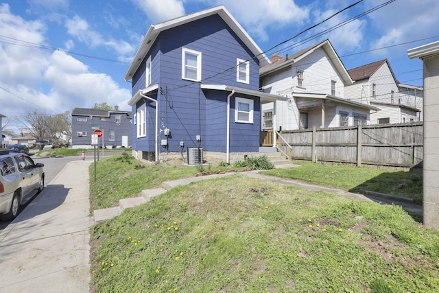rear view of property with fence