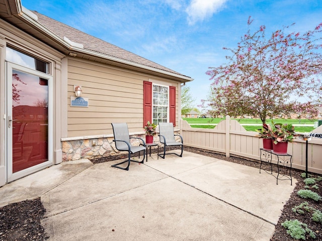 view of patio / terrace featuring fence