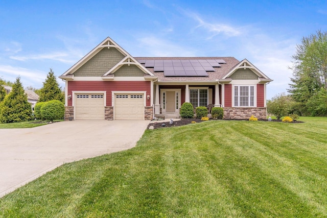 craftsman-style home featuring a front lawn, stone siding, a garage, concrete driveway, and solar panels