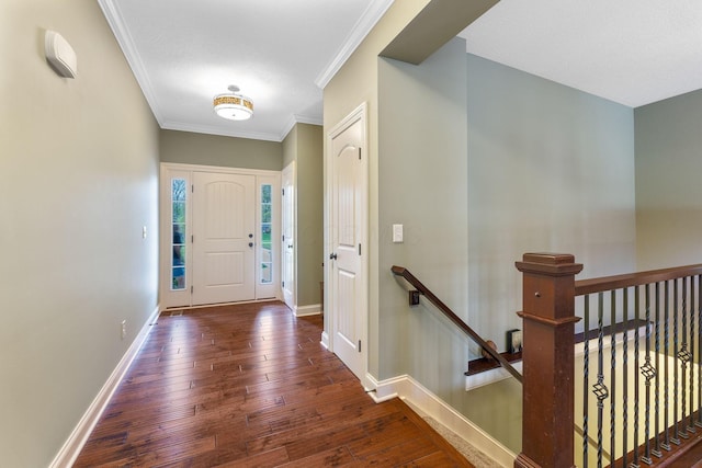 entrance foyer with crown molding, baseboards, and wood-type flooring