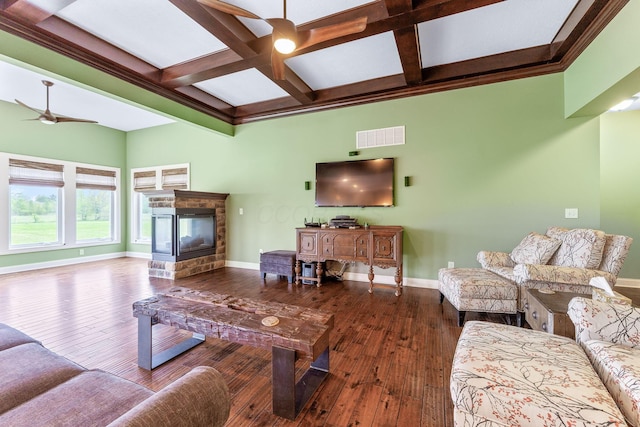 living room with visible vents, hardwood / wood-style floors, baseboards, a ceiling fan, and coffered ceiling
