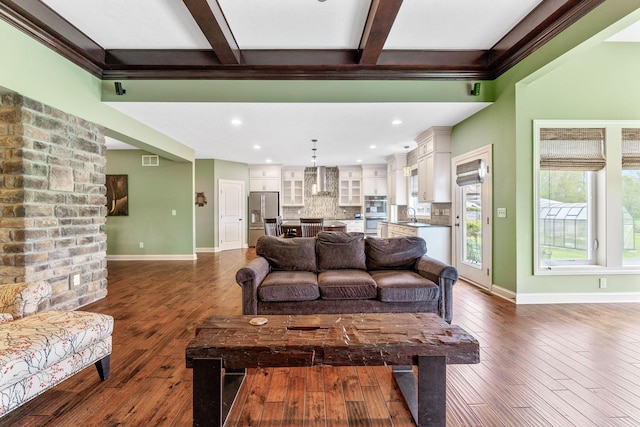 living room featuring recessed lighting, baseboards, beamed ceiling, visible vents, and dark wood-style floors