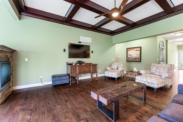 living area with a ceiling fan, visible vents, baseboards, coffered ceiling, and hardwood / wood-style floors