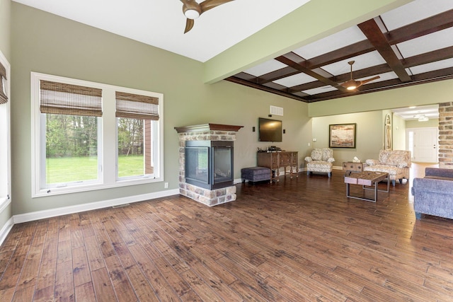living room with a ceiling fan, beamed ceiling, hardwood / wood-style flooring, and coffered ceiling