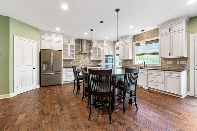 dining space with baseboards, recessed lighting, and dark wood-type flooring