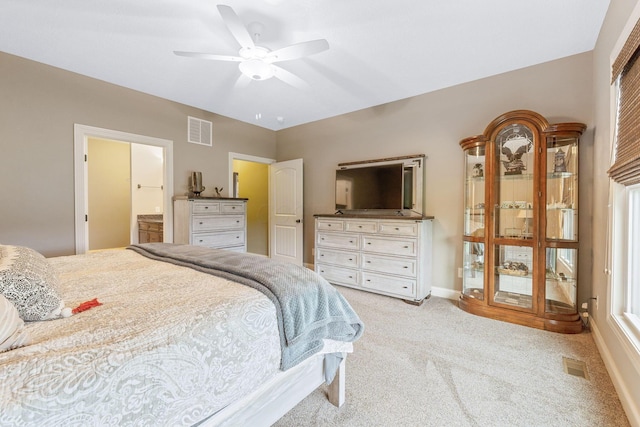 bedroom with baseboards, a ceiling fan, light colored carpet, and visible vents