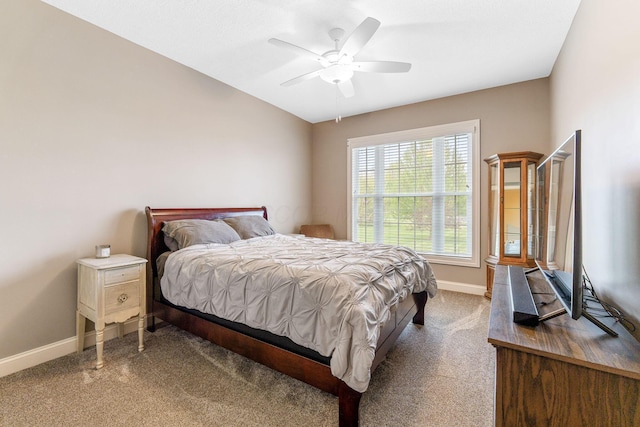 bedroom featuring baseboards, a ceiling fan, and carpet
