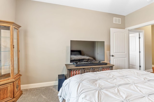 bedroom with carpet floors, baseboards, and visible vents