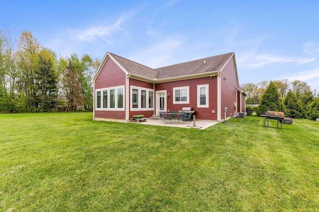 back of house with a lawn, a patio area, and cooling unit