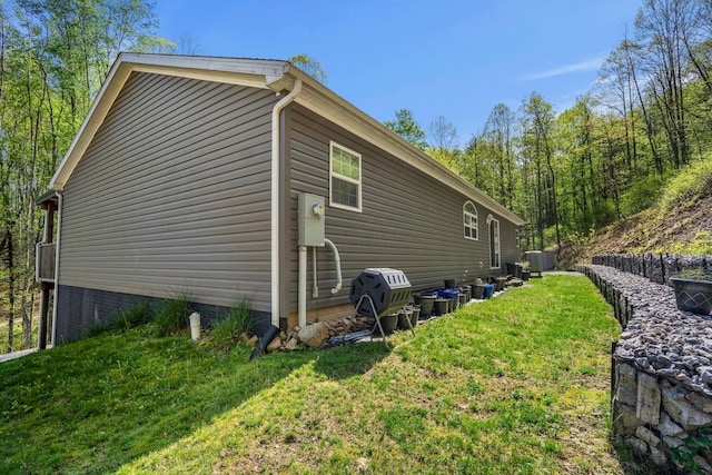 24796 E Fork Rd, Laurelville, OH 43135 - view of home's exterior featuring central air condition unit and a lawn