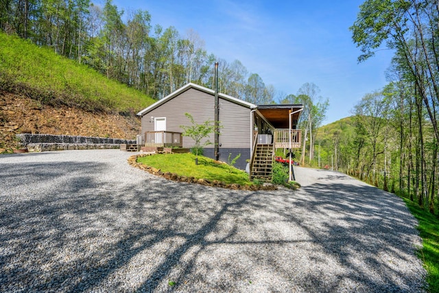 24796 E Fork Rd, Laurelville, OH 43135 - view of side of home featuring stairway and driveway