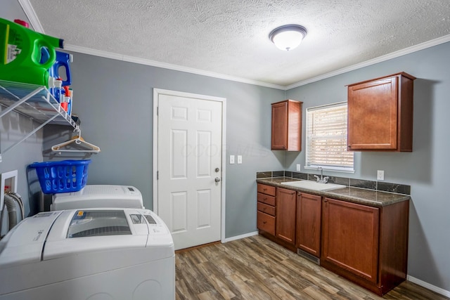 24796 E Fork Rd, Laurelville, OH 43135 - laundry area with washer and dryer, a textured ceiling, a sink, and dark wood-type flooring