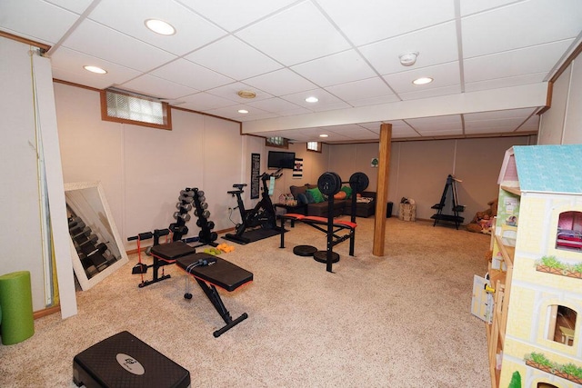 workout room featuring recessed lighting, carpet floors, and a drop ceiling