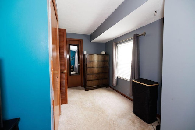 unfurnished bedroom with baseboards and carpet flooring