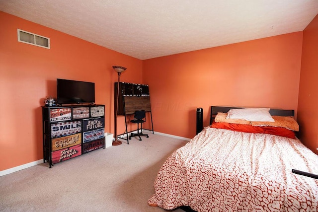 carpeted bedroom with baseboards and visible vents
