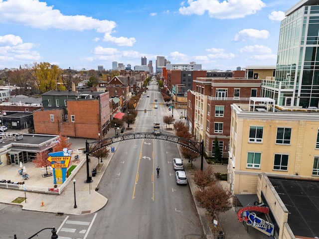 884 Neil Ave, Columbus, OH 43215 - view of asphalt road featuring curbs, sidewalks, a view of city, and street lighting