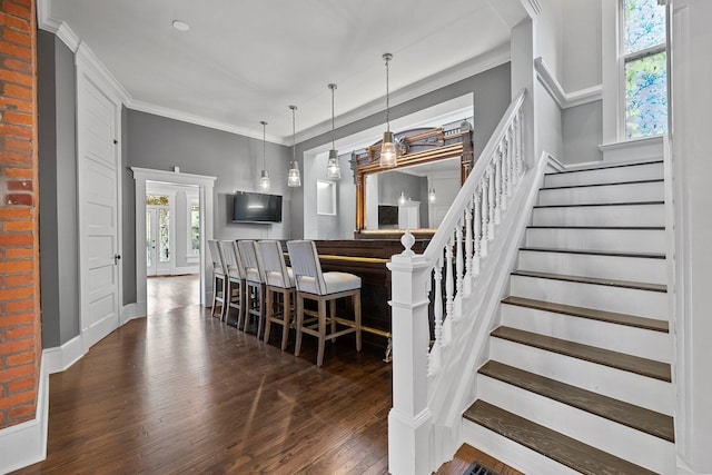 884 Neil Ave, Columbus, OH 43215 - staircase with wood-type flooring and ornamental molding