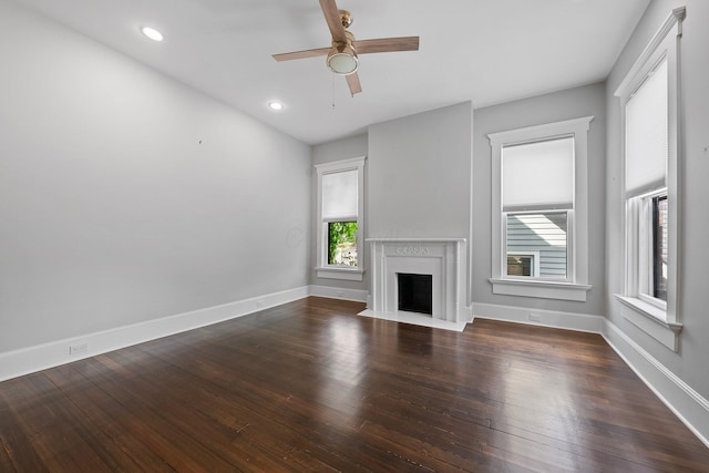 884 Neil Ave, Columbus, OH 43215 - unfurnished living room featuring a fireplace with flush hearth, a ceiling fan, wood finished floors, and recessed lighting