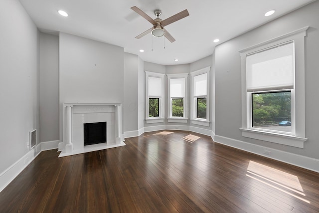 884 Neil Ave, Columbus, OH 43215 - unfurnished living room featuring a ceiling fan, a fireplace with flush hearth, hardwood / wood-style floors, and recessed lighting