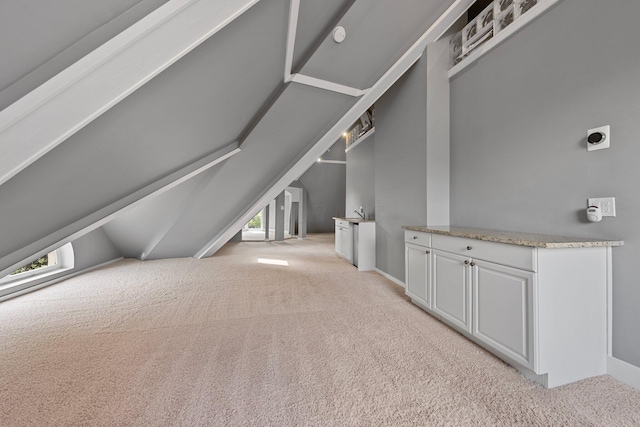 884 Neil Ave, Columbus, OH 43215 - additional living space featuring plenty of natural light, light carpet, and vaulted ceiling