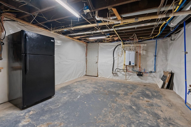 884 Neil Ave, Columbus, OH 43215 - unfinished basement featuring freestanding refrigerator and tankless water heater