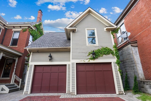 884 Neil Ave, Columbus, OH 43215 - view of front facade featuring decorative driveway and an attached garage