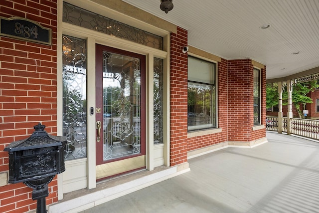 884 Neil Ave, Columbus, OH 43215 - property entrance with a porch and brick siding