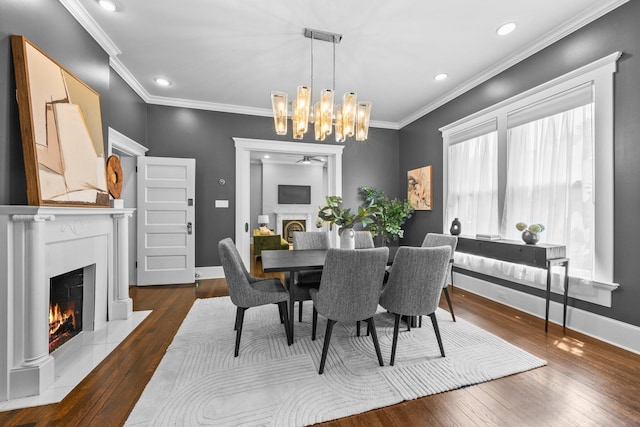 884 Neil Ave, Columbus, OH 43215 - dining space featuring a fireplace with flush hearth, hardwood / wood-style flooring, ornamental molding, a chandelier, and recessed lighting
