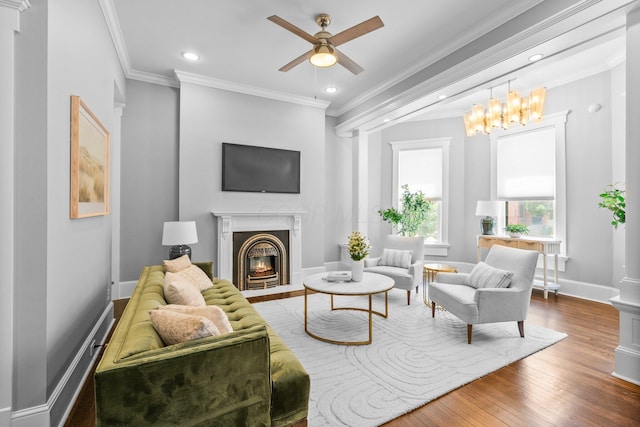 884 Neil Ave, Columbus, OH 43215 - living area featuring ceiling fan, a fireplace with flush hearth, recessed lighting, wood finished floors, and crown molding