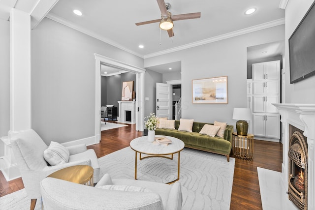 884 Neil Ave, Columbus, OH 43215 - living area featuring a warm lit fireplace, ceiling fan, recessed lighting, ornamental molding, and dark wood-type flooring