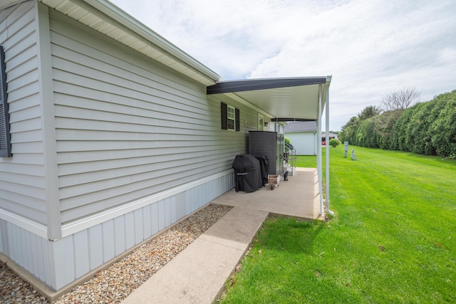 view of side of property with a yard