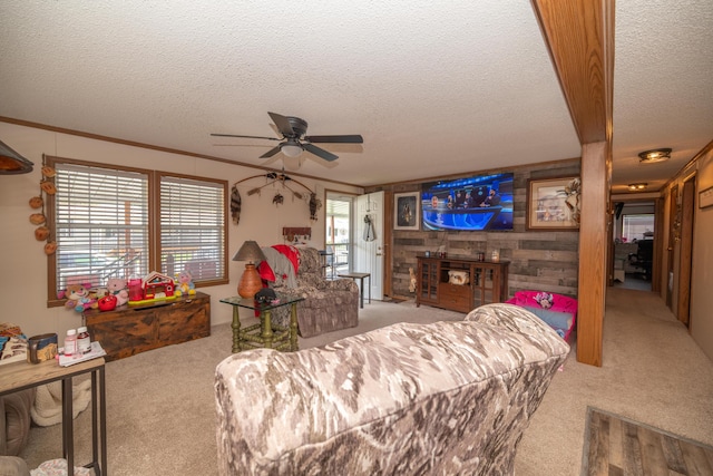 carpeted living area with crown molding, ceiling fan, and a textured ceiling