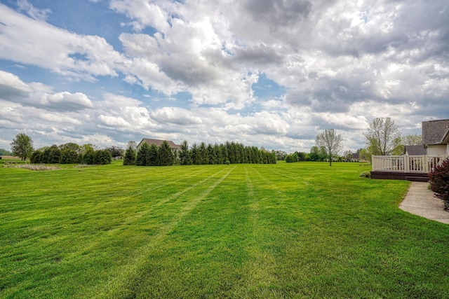 4656 Meadowgrove Dr NW, Carroll, OH 43112 - view of green lawn featuring a deck