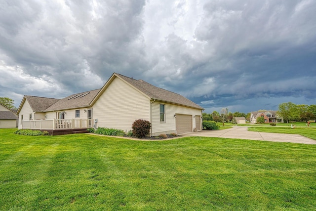 4656 Meadowgrove Dr NW, Carroll, OH 43112 - view of property exterior featuring concrete driveway, a yard, a wooden deck, and roof with shingles