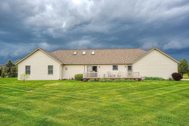 4656 Meadowgrove Dr NW, Carroll, OH 43112 - back of property with a lawn, a wooden deck, and roof with shingles