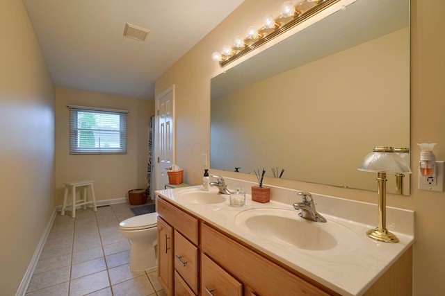 4656 Meadowgrove Dr NW, Carroll, OH 43112 - bathroom with tile patterned flooring, toilet, double vanity, and baseboards