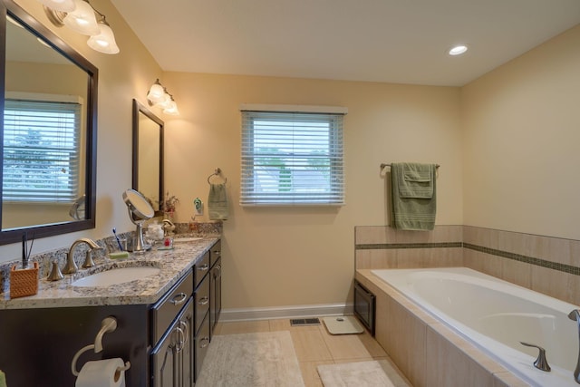 4656 Meadowgrove Dr NW, Carroll, OH 43112 - bathroom with double vanity, plenty of natural light, a bath, and tile patterned flooring