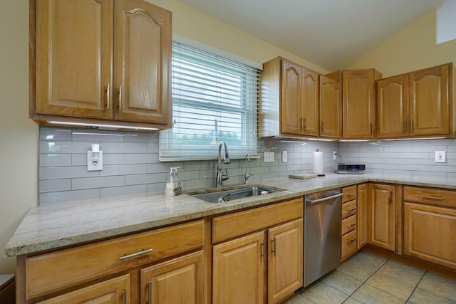 4656 Meadowgrove Dr NW, Carroll, OH 43112 - kitchen featuring a sink, dishwasher, light stone countertops, decorative backsplash, and vaulted ceiling