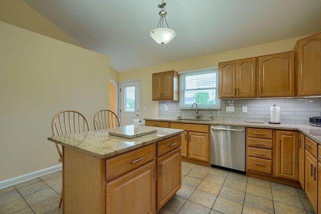4656 Meadowgrove Dr NW, Carroll, OH 43112 - kitchen featuring dishwasher, a sink, decorative backsplash, a kitchen island, and light tile patterned flooring