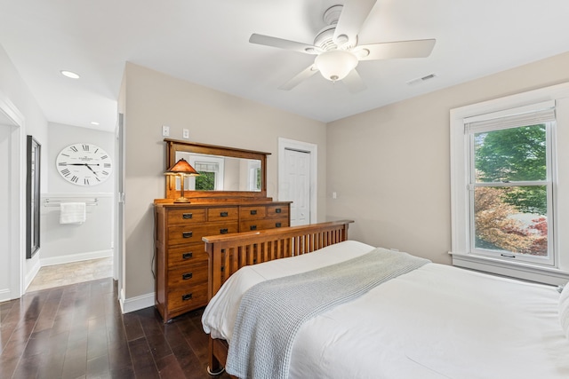 bedroom featuring ceiling fan, dark wood finished floors, recessed lighting, baseboards, and visible vents