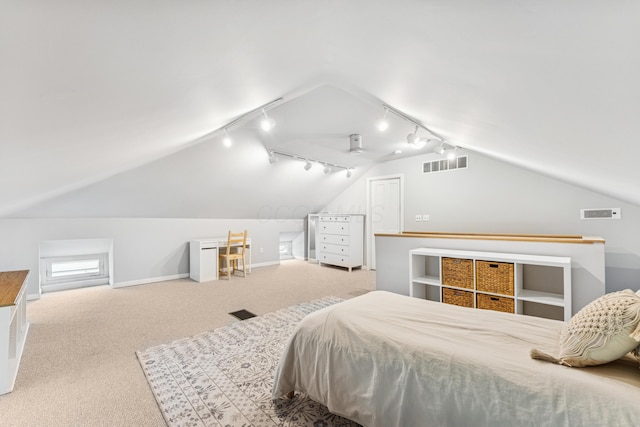 bedroom with track lighting, carpet, vaulted ceiling, and visible vents