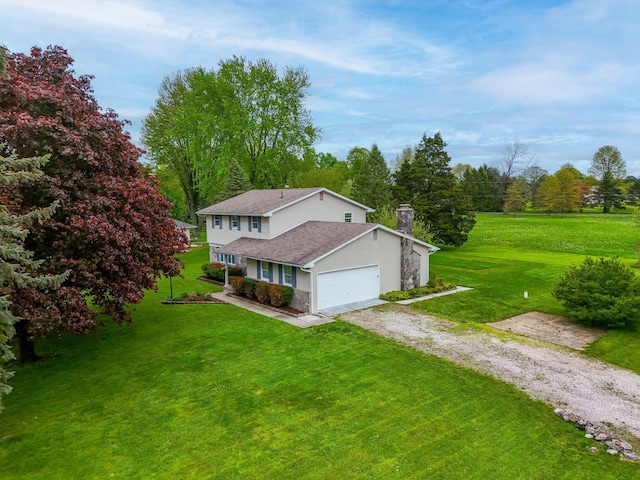view of side of home with a yard, driveway, stucco siding, and a chimney
