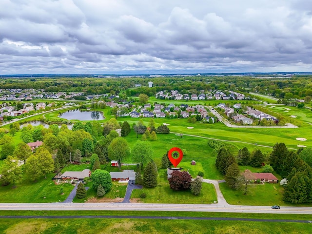 bird's eye view featuring view of golf course, a water view, and a residential view